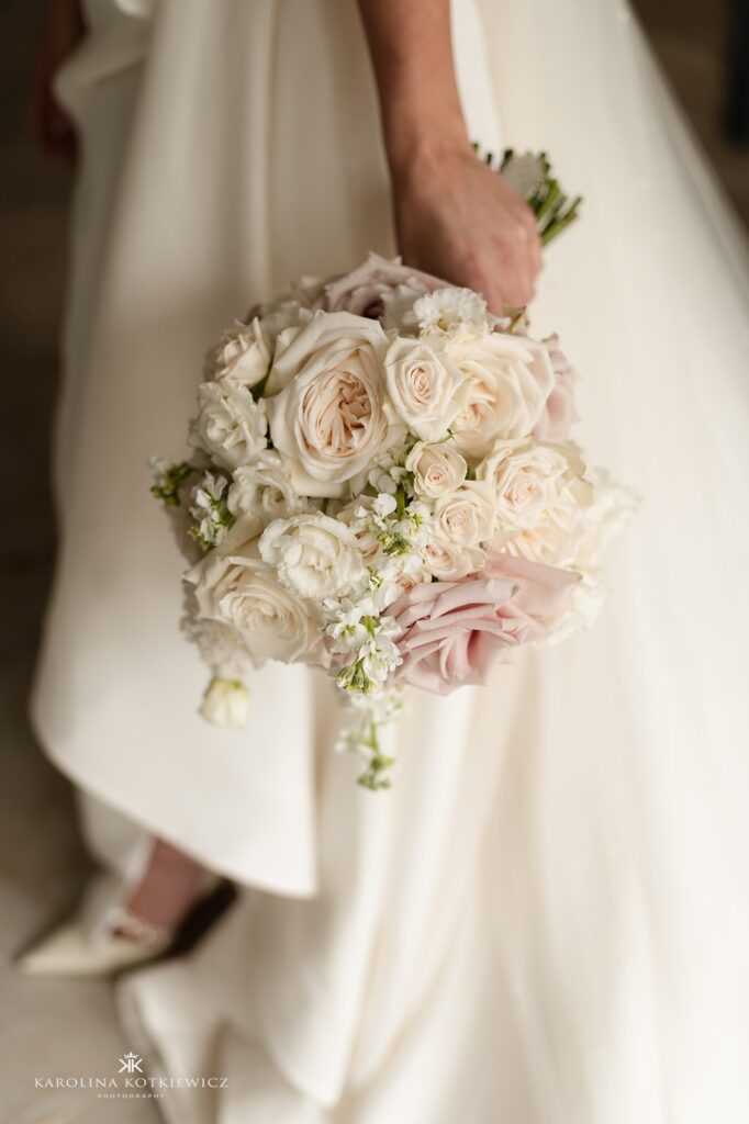 Close-up of bride holding a hand-tied bouquet of ivory and blush roses, created by Paperwhite Floral Design at Brig O' Doon, Ayrshire.